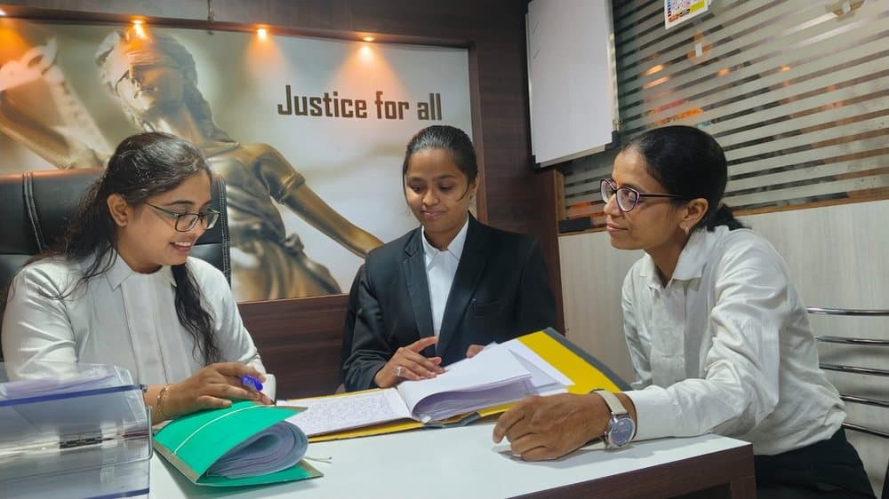 Advocates advising a parent on a child custody matter at the Kasba Peth chamber, Pune
